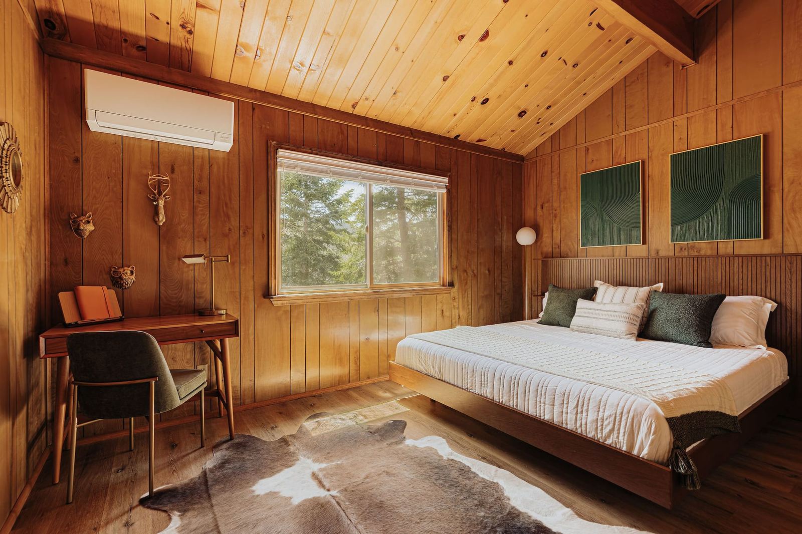 King bedroom with desk and cowhide rug