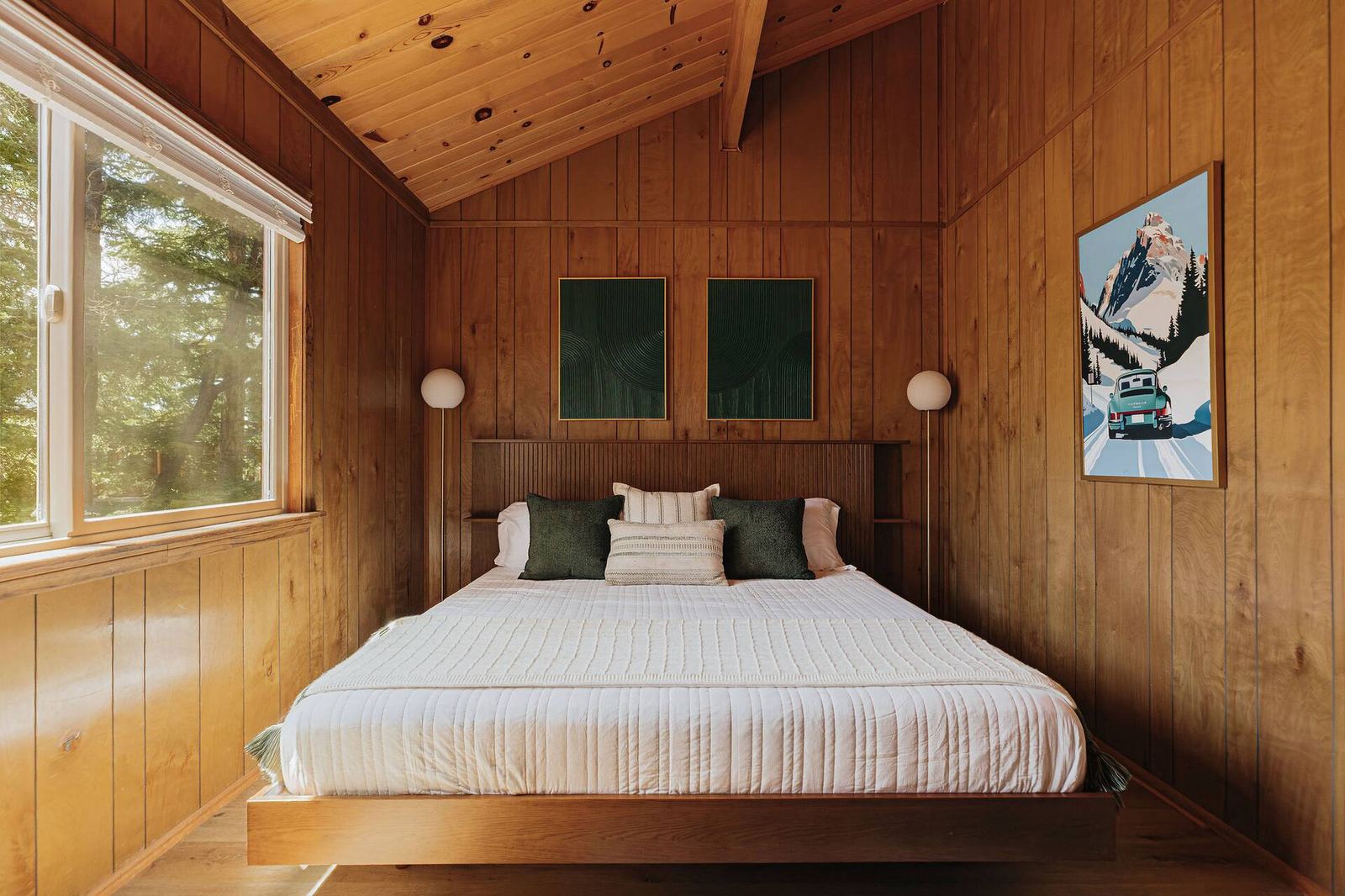 King bed with green accent pillows