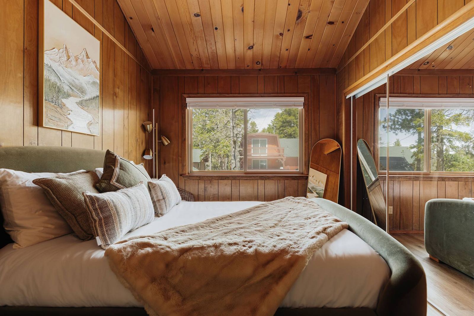Queen bedroom with mountain artwork