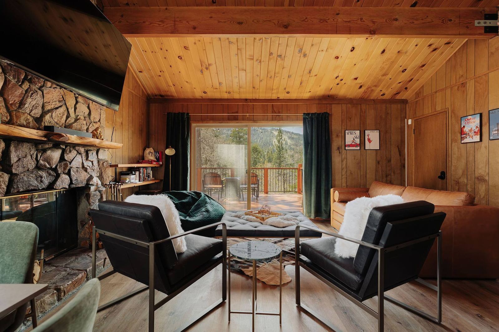 Living room seating area by the rock fireplace